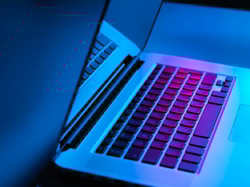 Retail employee using G Suite integration to help customer in clothing store